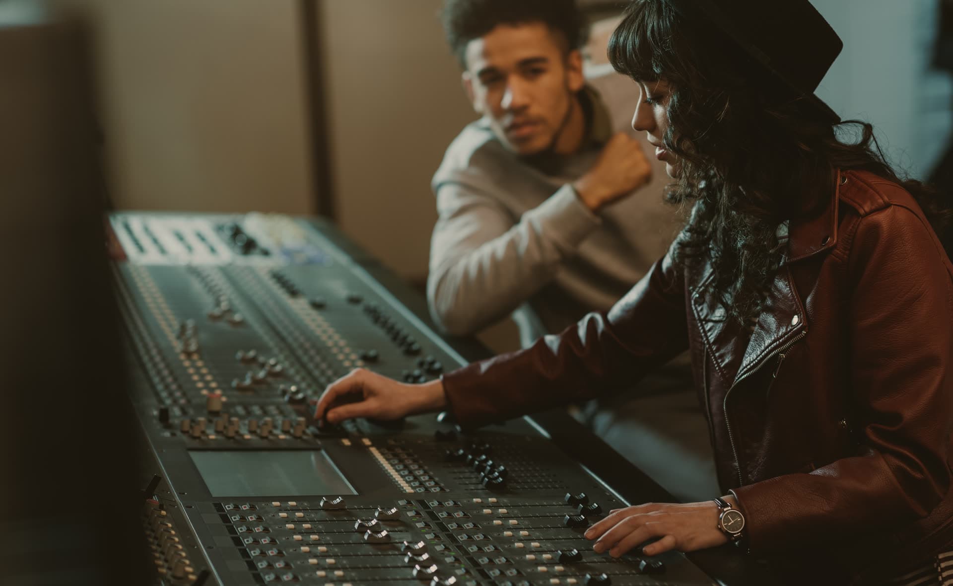 Studio producers at the mixing console